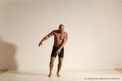 Underwear Gymnastic poses Man Black Muscular Bald Dancing Dynamic poses Academic